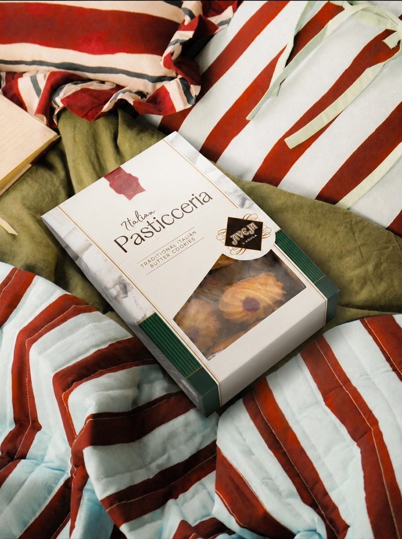 Generated scene — a Pasticceria box resting on striped bed linens